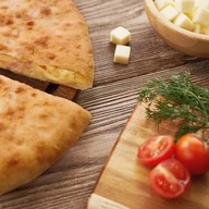 Осетинский с ветчиной, сыром и грибами Фото