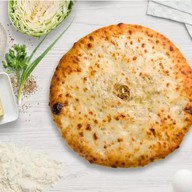 Осетинский пирог с сыром и капустой Фото