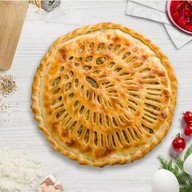 Осетинский пирог с семгой и томатами Фото
