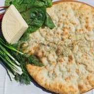 Осетинский пирог сыр, свекольные листья Фото
