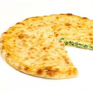Осетинский пирог с сыром и зеленью Фото