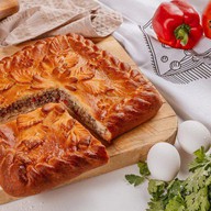 Пирог с мясом, моцареллой, и перцем Фото