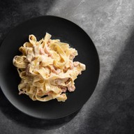 Паста с морепродуктами в сливочном соусе Фото