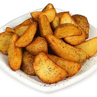 Картофельные дольки со специями Фото