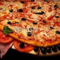 Пицца с ветчиной Фото