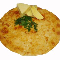 Осетинский пирог с сыром и картофелем Фото
