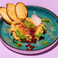 Хумус с томатной сальсой,зернами граната Фото