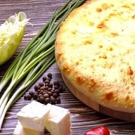 Осетинский пирог с сыром и капустой Фото
