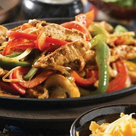 Горячая сковородка с курицей Фото