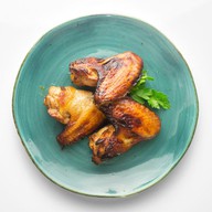 Крылья куриные жареные в соусе Фото