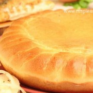 С окунем, картофелем и луком Фото