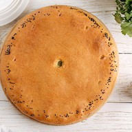 Пирог осетинский с сыром и  картофелем Фото