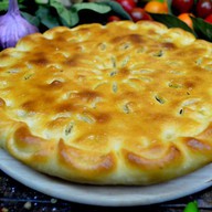 Осетинский пирог с сыром и картошкой Фото