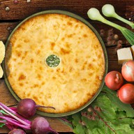 Осетинский пирог с листьями и сыром Фото