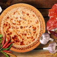 Осетинский пирог с мясом и сыром Фото