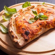 Кальцоне пицца (закрытая) Фото