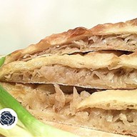 Осетинский пирог с капустой и гри Фото