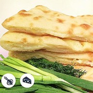 Осетинский пирог с сыром и зелены Фото