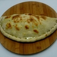 Закрытая пицца Кальцоне Фото