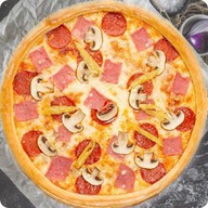Пицца с ветчиной и грибами Фото