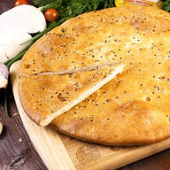 Осетинский пирог с курицей и сыром Фото