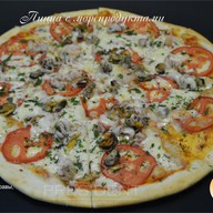 Пицца с морепродуктами Фото