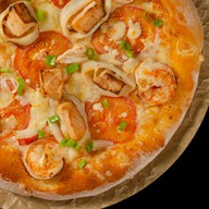 Пицца с морепродуктами Фото